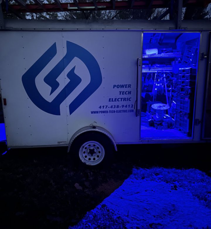 A service truck equipped with tools and supplies, ready to provide emergency electrical solutions at night.